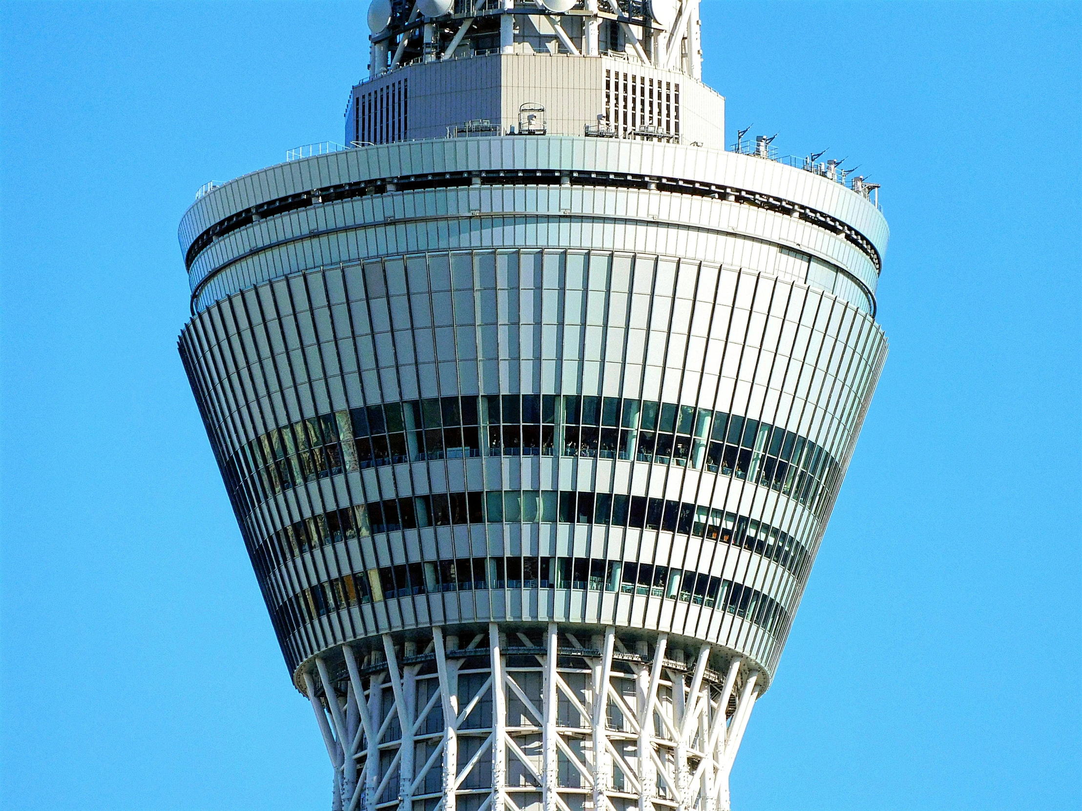 a tall tower with a clock on top of it, by Bradley Walker Tomlin, sōsaku hanga, japan tokyo skytree, zoomed out view, getty images, helipad