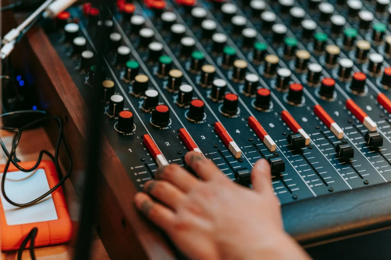 a close up of a person's hand on a sound mixer, trending on pexels, 🦩🪐🐞👩🏻🦳, avatar image, background image, candid shot