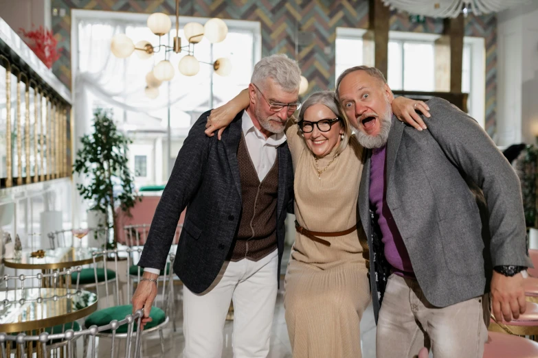 a group of people standing next to each other in a room, a portrait, pexels contest winner, grey beard, in style of terry richardson, sandra chevrier and john hoyland, anomalisa