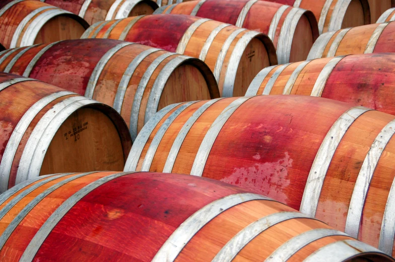 a bunch of wooden barrels sitting next to each other, by Robert Thomas, wine-red and grey trim, bay area, vivid lines, lots of swirling