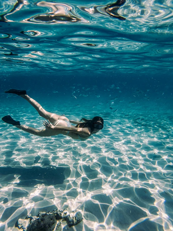 there is a man that is swimming in the water, unsplash contest winner, kristen bell as a mermaid, scuba diving, 🌸 🌼 💮, sea bottom