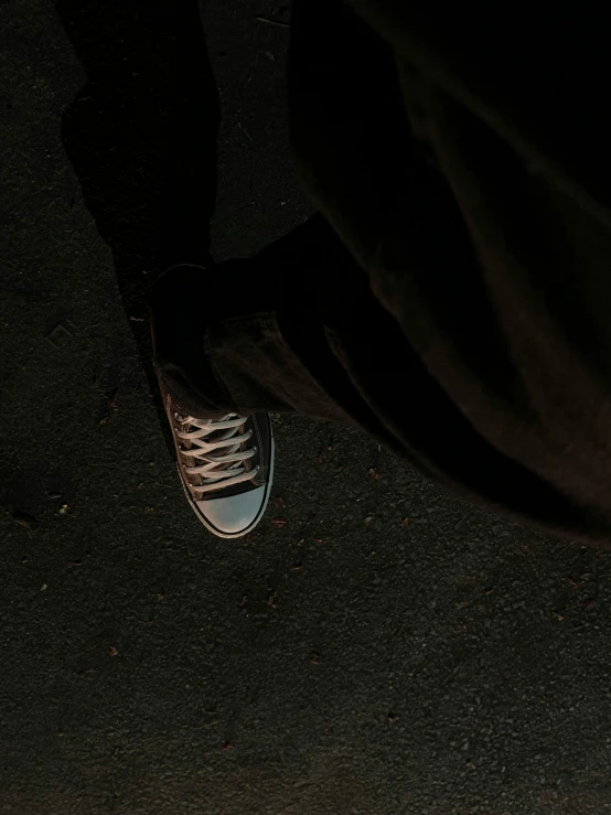 a person standing on a skateboard in the dark, wearing white sneakers, ((oversaturated)), muted colors. ue 5, carson ellis