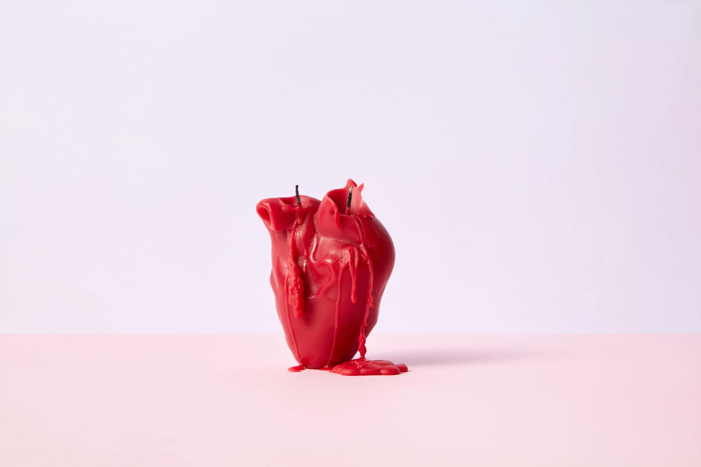 a red candle sitting on top of a pink table, by Gavin Hamilton, trending on pexels, hyperrealism, 3d model of a human heart, paint drips liquid wax, comme des garcon campaign, dwell