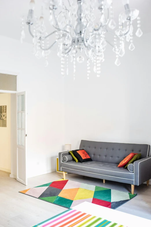 a living room filled with furniture and a chandelier, inspired by Emilio Grau Sala, unsplash, light and space, okuda, city apartment cozy calm, lisbon, profile image
