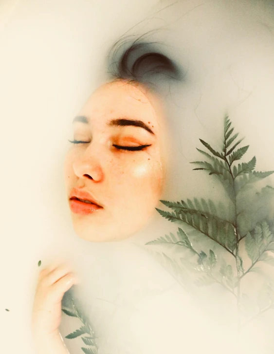 a woman laying in a bath with her eyes closed, inspired by Elsa Bleda, trending on pexels, process art, eucalyptus, a woman's profile, foggy effect, ilustration