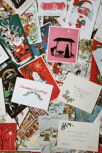 a pile of christmas cards sitting on top of a table, by Ellen Gallagher, pexels, mail art, 1960s-era, 🎨🖌️, ffffound, brittney lee