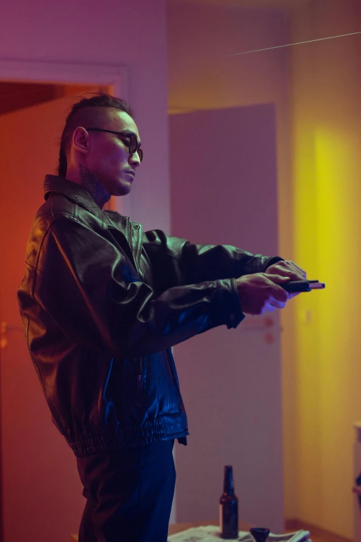 a man standing in a living room holding a remote, cyberpunk art, inspired by Zhu Da, trending on pexels, wearing cyberpunk leather jacket, performance, shot from the side, top down