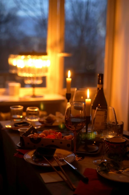 a table that has a lot of food on it, by Else Alfelt, romanticism, warm ambient lighting, winter, wining, evening light