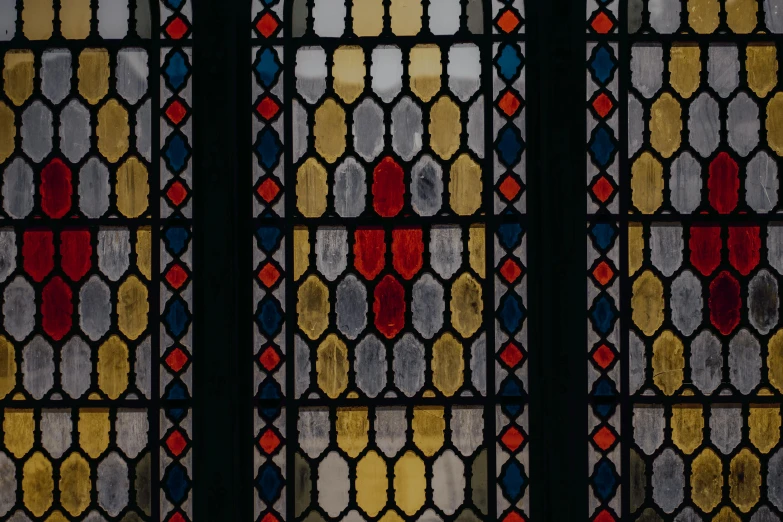 a close up of a stained glass window, inspired by Johannes Bosschaert, unsplash, nadav kander, payne's grey and venetian red, demur, 19th-century