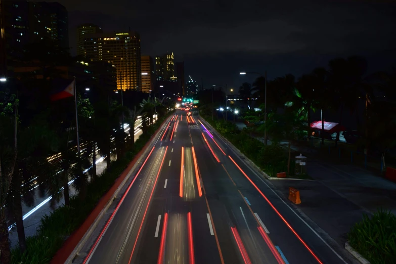 a city street filled with lots of traffic at night, by Alejandro Obregón, pexels contest winner, manila, high speed, landscape photo, panels