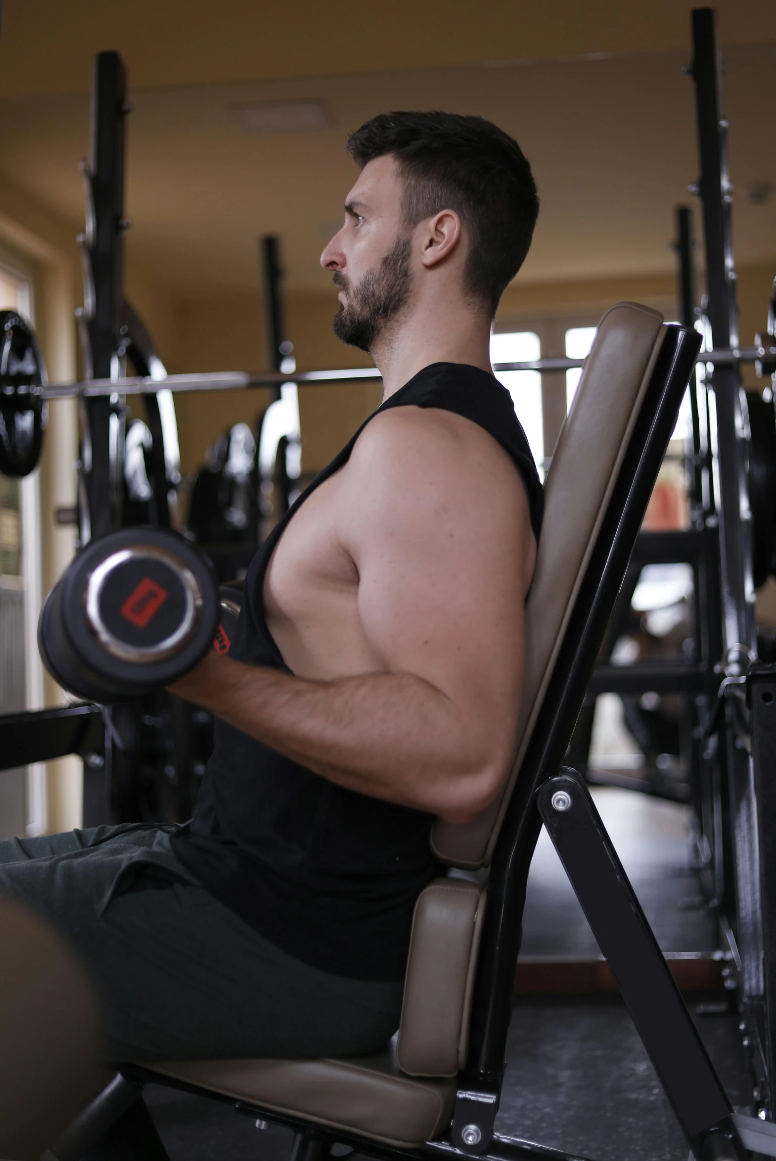 a man sitting on top of a bench in a gym, featured on reddit, renaissance, centered shoulders up view, promo image, color footage, background image