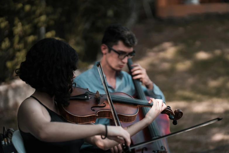 a couple of people that are playing violin, an album cover, pexels contest winner, ritual in a forest, avatar image, performance, in the yard