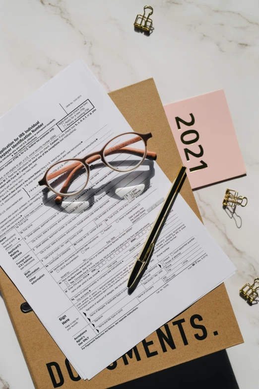 a pair of glasses sitting on top of a piece of paper, a picture, thumbnail, abcdefghijklmnopqrstuvwxyz, forms, curated collections