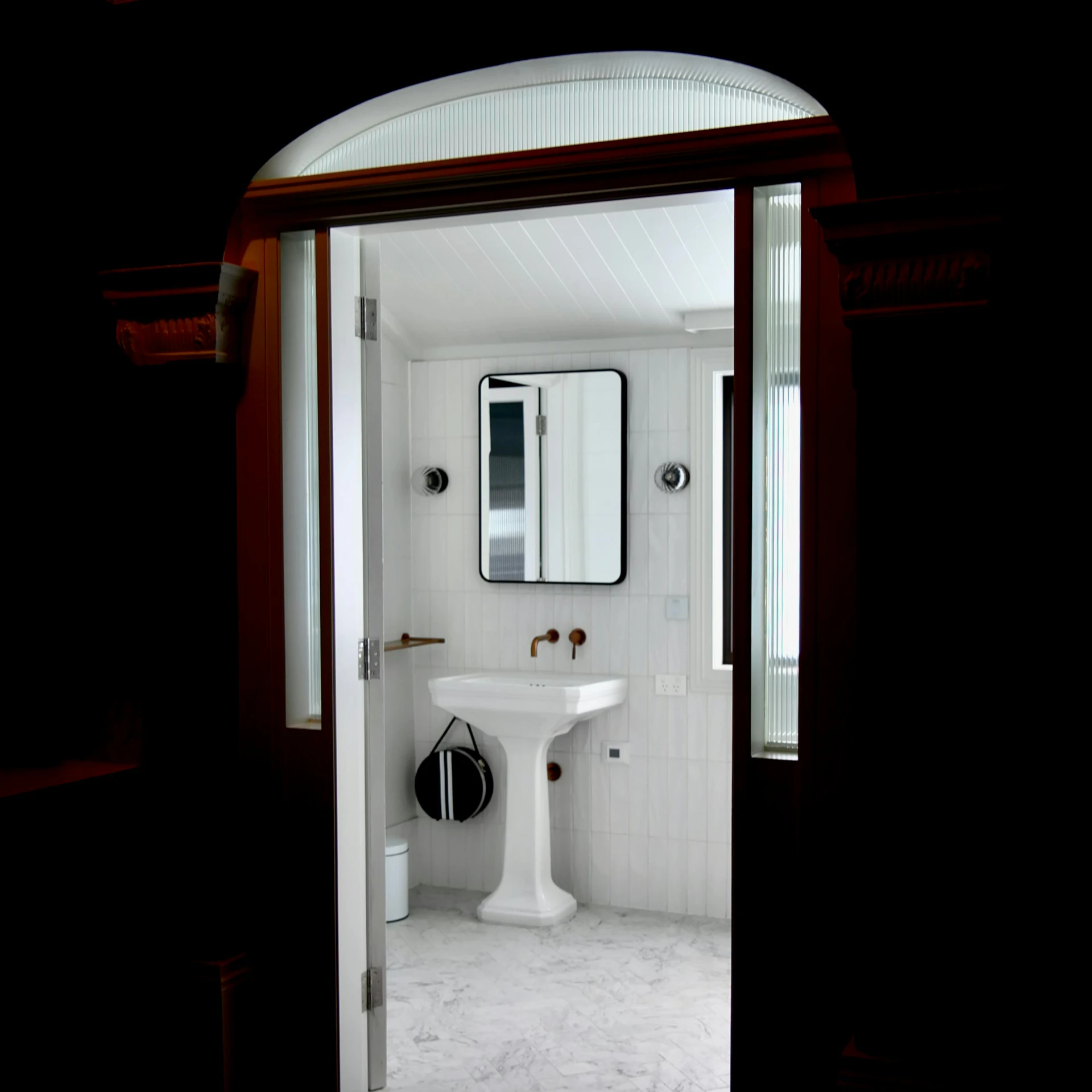 a bath room with a toilet a sink and a mirror, inspired by Thomas Struth, sea cloud, with archways, cinematic front shot, keyhole