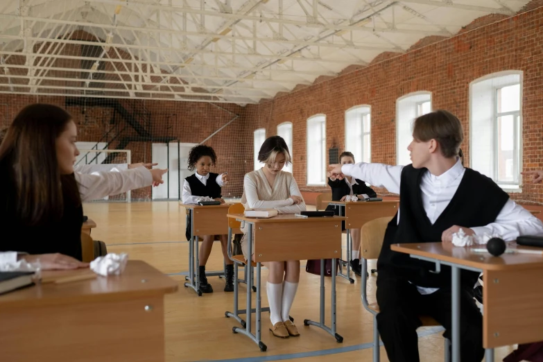 a group of students sitting at desks in a classroom, by Anna Findlay, style of ilya kushinov, wearing a school uniform, actor, thumbnail