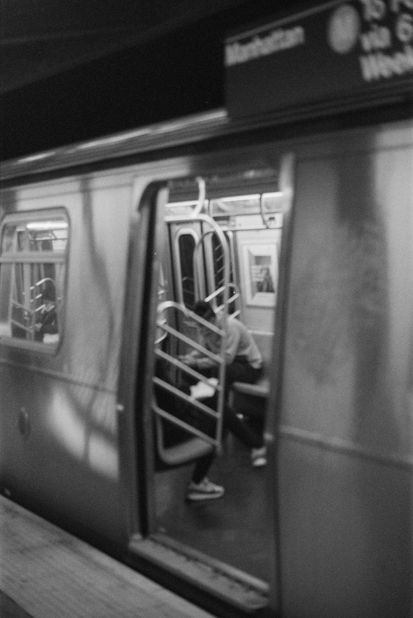 a black and white photo of a subway train, inspired by Louis Stettner, realism, hyperrealistic movie filmstill, ffffound, barbara canepa, hyper-realism