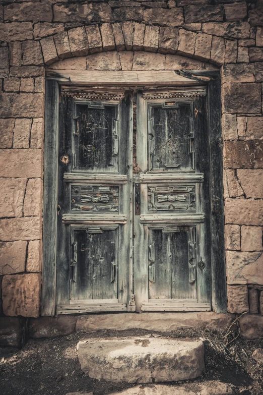 an old wooden door in a stone building, an album cover, pexels contest winner, damascus, windows, square, distressed