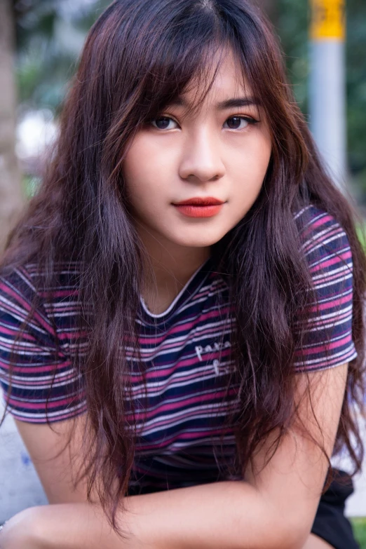 a close up of a person sitting on a bench, asian girl with long hair, bangs and wavy hair, wearing stripe shirt, in style of lam manh