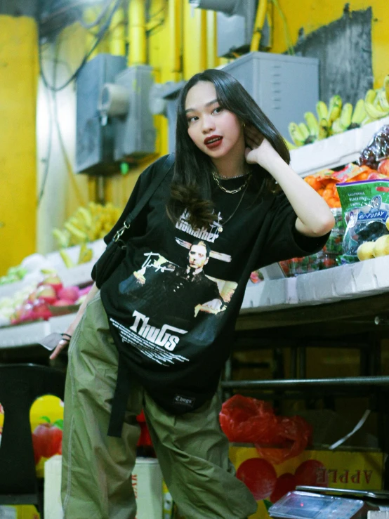 a woman standing in front of a fruit stand, a picture, inspired by Gang Hui-an, tumblr, black t-shirt, official product photo, detailed », 90's photo