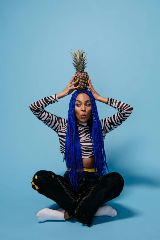 a woman with blue hair and a pineapple on her head, an album cover, inspired by Jessie Alexandra Dick, trending on pexels, vanessa morgan, expressive pose, sza, taken with sony alpha 9