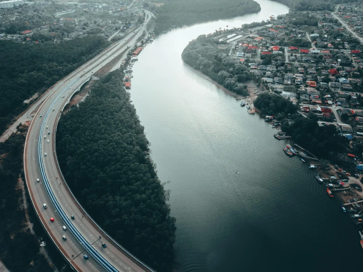 an aerial view of a river running through a city, pexels contest winner, hurufiyya, freeway, low quality photo, high res 8k, multiple stories