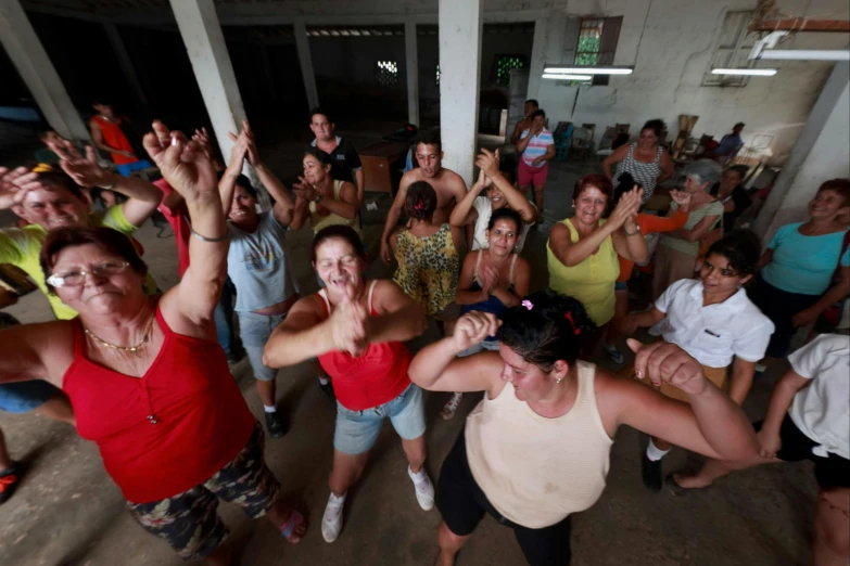 a group of people that are standing in a room, happening, fat latin woman dancing, reuters, bolsonaro, rural