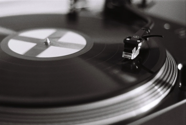 a black and white photo of a turntable, an album cover, pexels contest winner, fan favorite, hd footage, smooth metal, hifi