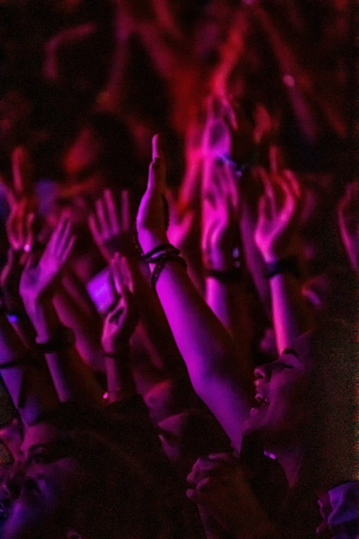 a crowd of people with their hands in the air, aestheticism, blacklight, uploaded, album, spectators