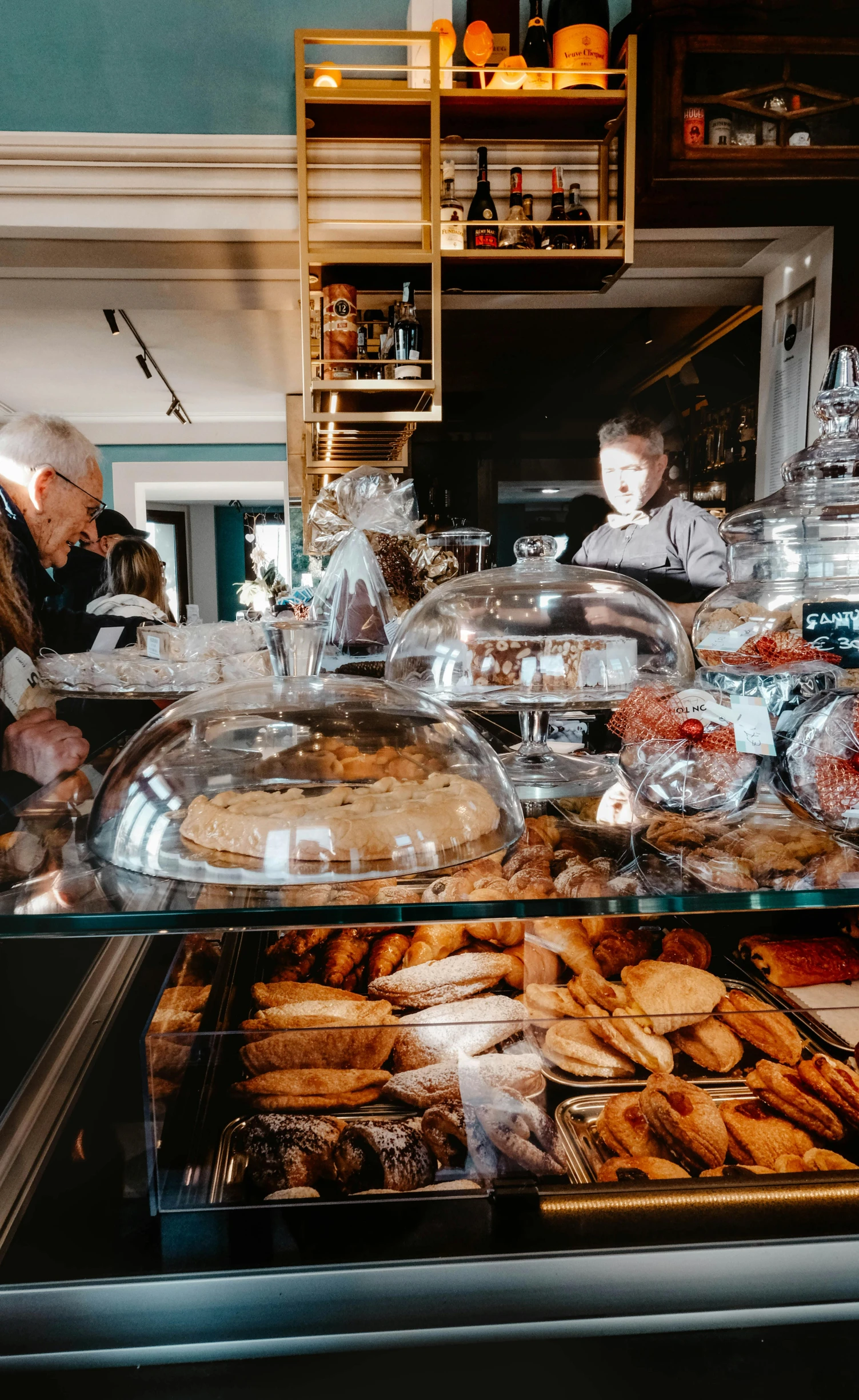 a bakery filled with lots of baked goods, by Jan Tengnagel, pexels, art nouveau, customers, panoramic shot, hard morning light, high quality photo