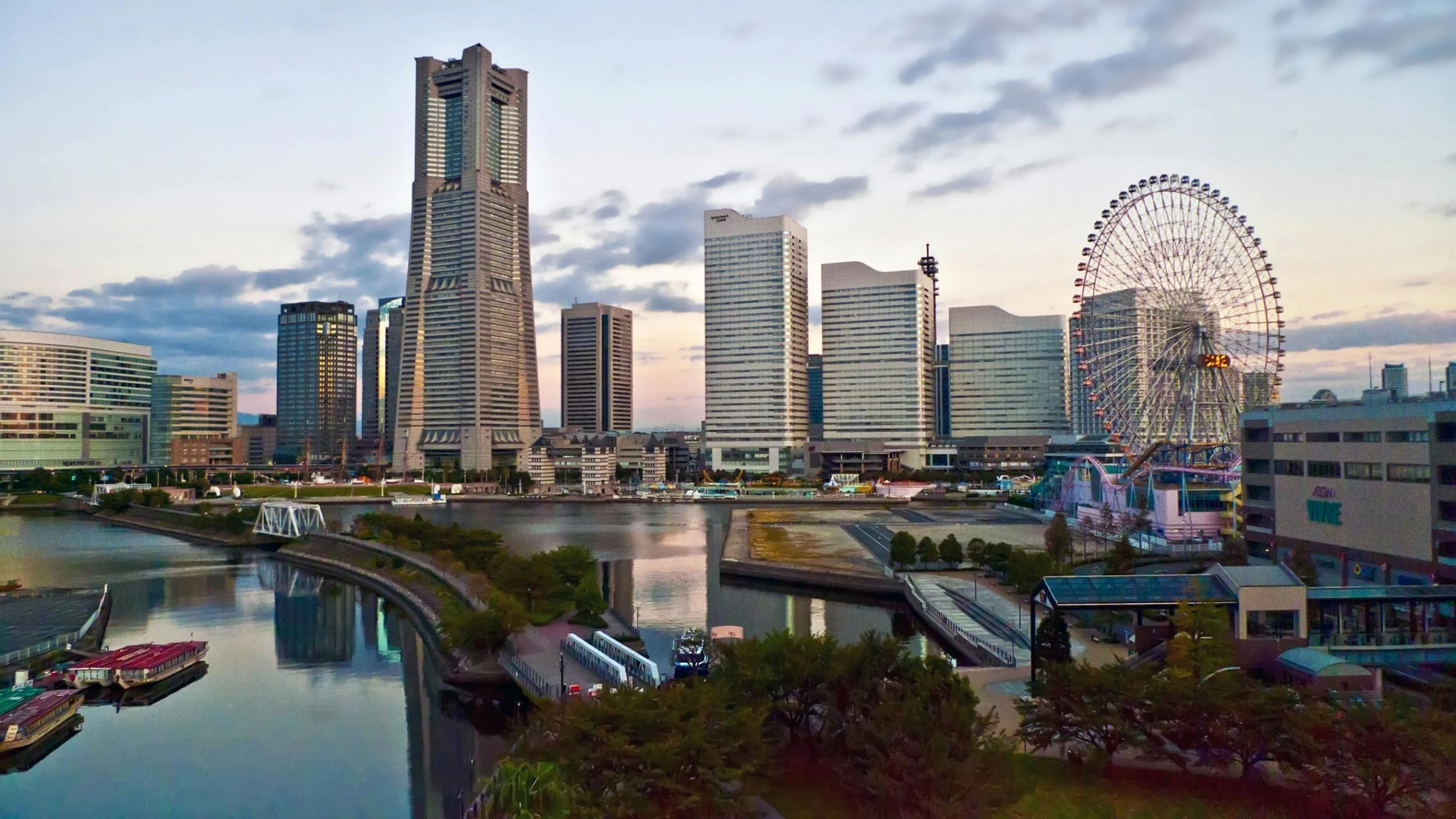 a body of water surrounded by tall buildings and a ferris wheel, sōsaku hanga, instagram post, skyscrapers with greenery, gigapixel photo