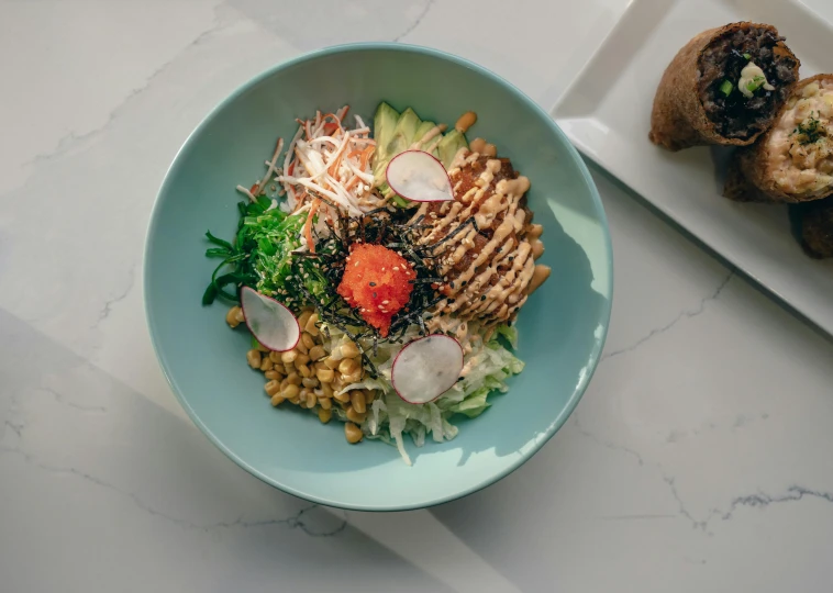 a bowl of food sitting on top of a table, inspired by Kanō Tan'yū, pexels contest winner, blue, salad, kete butcher, white bg