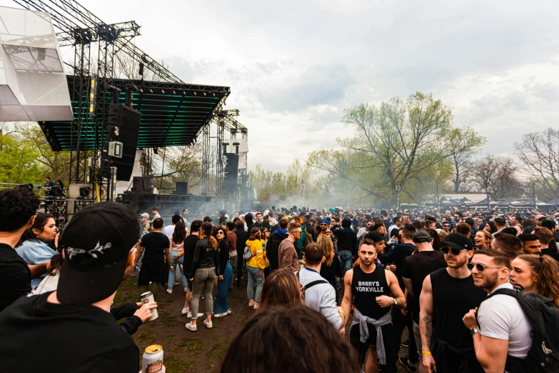 a large group of people standing in front of a stage, spring vibes, montreal, ground haze, venomize