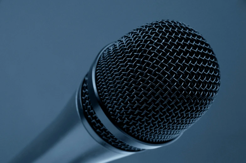 a close up of a microphone on a table, blue-black, no - text no - logo, multiple stories, hyperdetailed!!