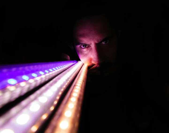 a close up of a person looking at a light, led lighting effects, tubes, portrait of tall, instagram photo