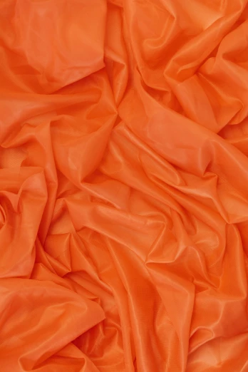 a close up of an orange fabric, inspired by Christo, reddit, baroque, chiffon, vinyl material, night setting, rapids
