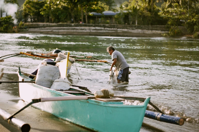 a couple of people that are in a boat, pexels contest winner, dau-al-set, people at work, rodrigo duterte, sustainability, 🦩🪐🐞👩🏻🦳