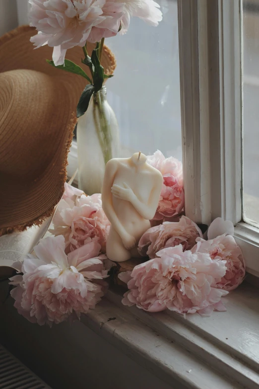 a hat sitting on top of a window sill next to flowers, a marble sculpture, inspired by Pierre Auguste Cot, unsplash, romanticism, soft blush, candle wax, sensual pose, many peonies