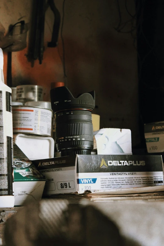 a bunch of items sitting on top of a table, a still life, inspired by Elsa Bleda, photorealism, lens dust, in an attic, photo taken on fujifilm superia, scientific equipment