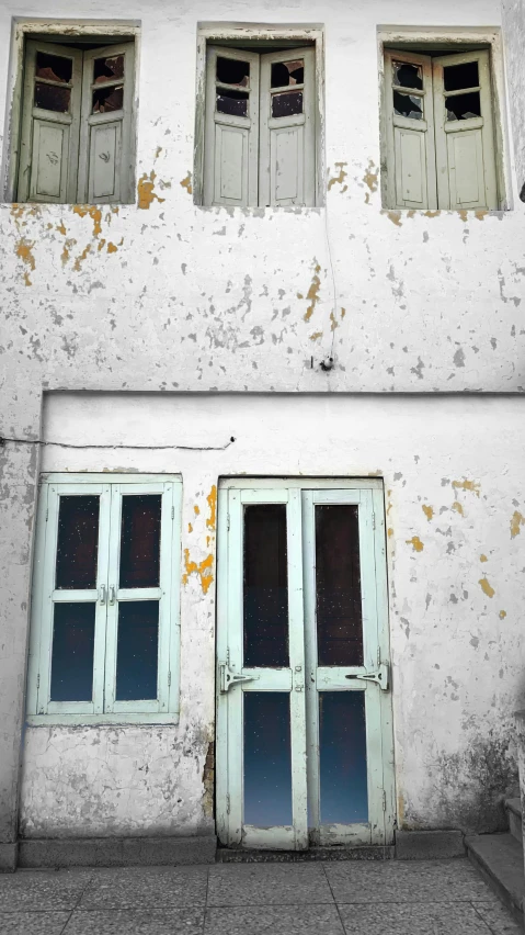 a couple of windows sitting on the side of a building, an album cover, by Lucia Peka, unsplash, sanjulian. detailed texture, square, white in color, 3 doors