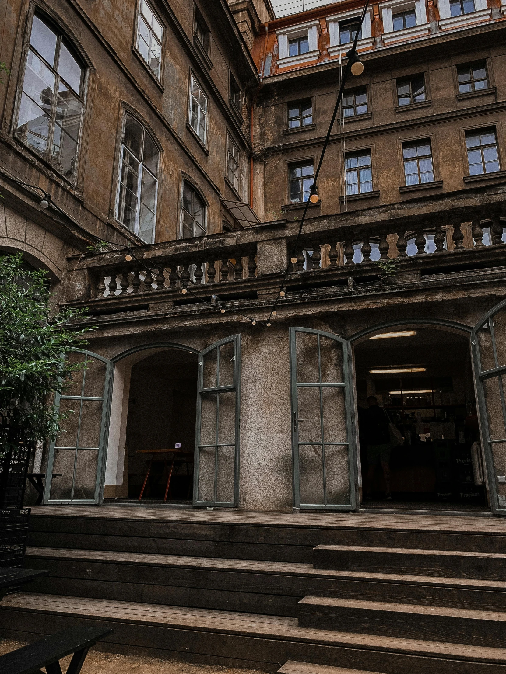 a man riding a skateboard up the side of a building, a photo, pexels contest winner, paris school, raining outside the cafe, detailed classical architecture, nvidia raytracing demo)))), doorway