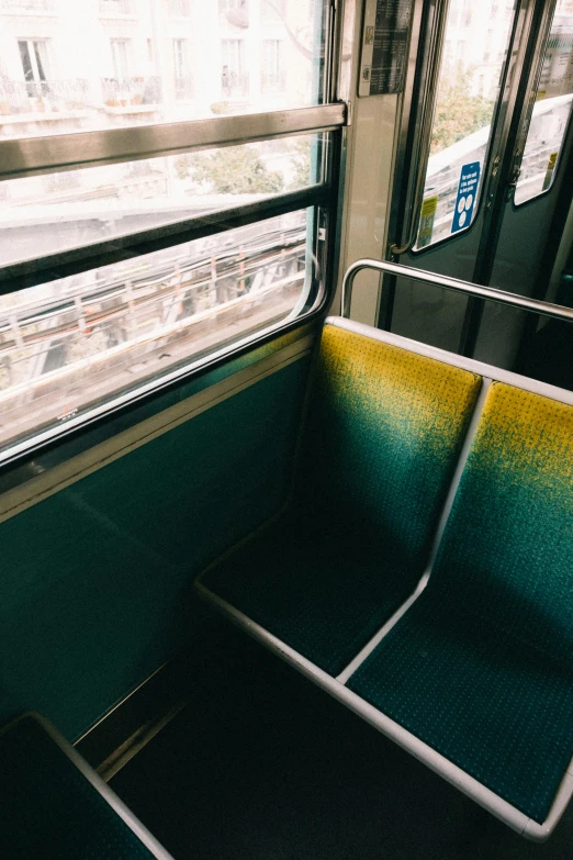 a couple of empty seats sitting next to each other, train window, tie-dye, teal gradient, 2019 trending photo