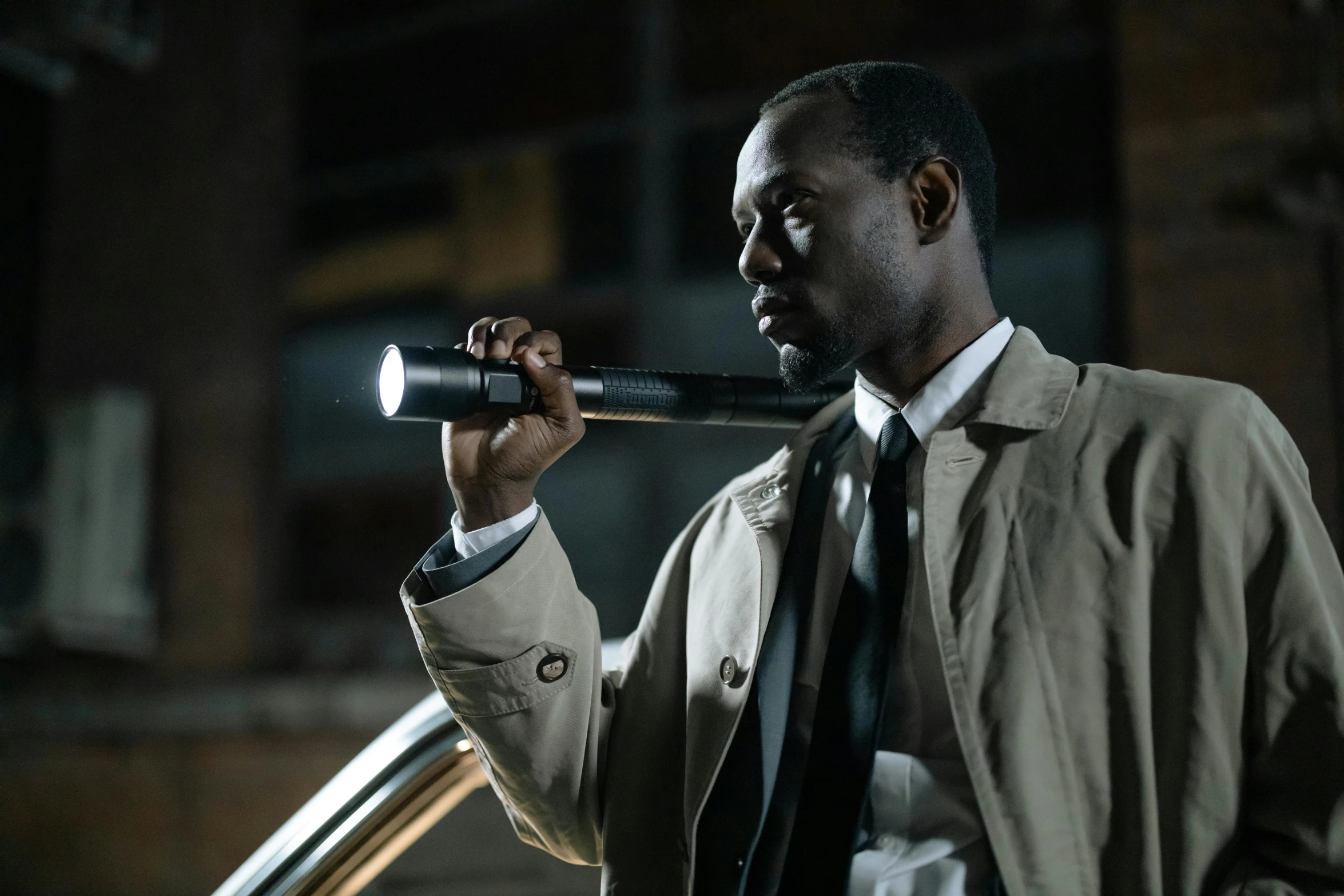 a man in a trench coat holding a baseball bat, pexels contest winner, flashlight on, lance reddick, security agent, full colour