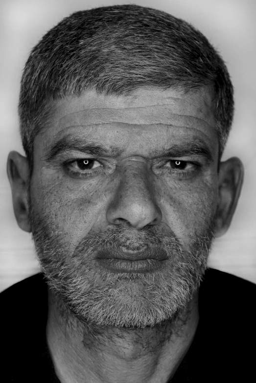 a black and white photo of a man with a beard, by Ahmed Yacoubi, hyperrealism, realistically rendered face, from egypt, he is about 5 0 years old, realistic 3d model