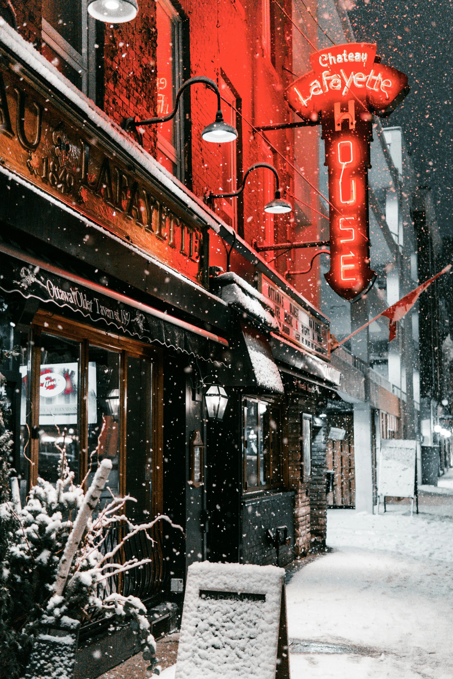 a snow covered sidewalk in front of a building, inspired by Kawase Hasui, unsplash contest winner, art nouveau, dimly lit dive bar, white and red color scheme, very smoky paris bar, profile pic