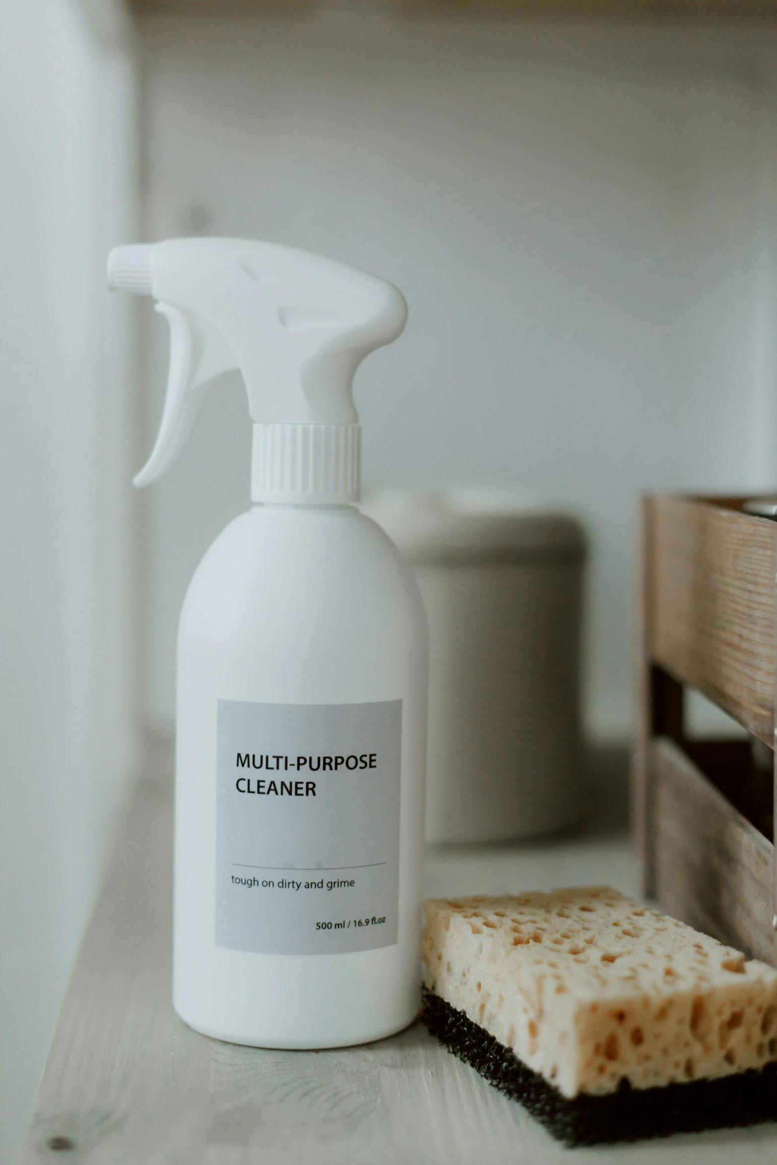 a bottle of cleanser sitting on top of a counter, a picture, by Julia Pishtar, unsplash, minimalist sticker, shelf, all white render, flour dust spray