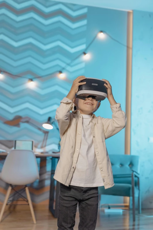 a little boy wearing a virtual reality headset, a hologram, trending on pexels, interactive art, brown and cyan blue color scheme, schools, instagram picture, developers