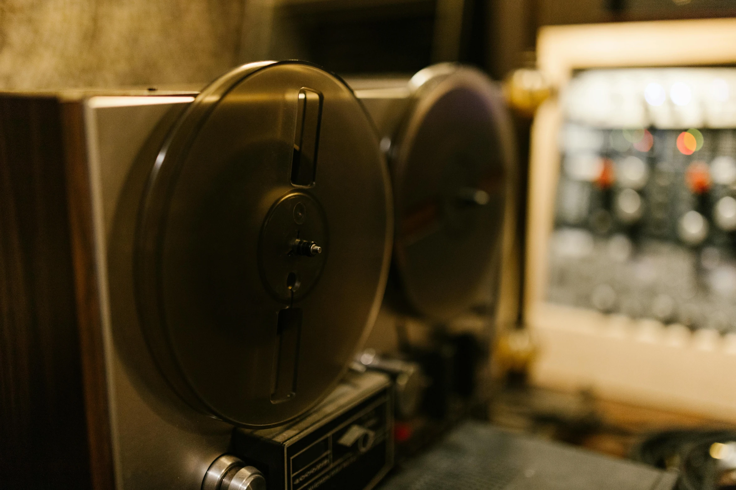 a couple of reels sitting on top of a table, unsplash, private press, tape deck, photo of the cinema screen, dials, old retro museum exhibition