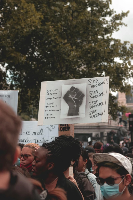a large group of people holding up signs, a photo, by Sebastian Vrancx, pexels, renaissance, photo of a black woman, square, tear, 15081959 21121991 01012000 4k