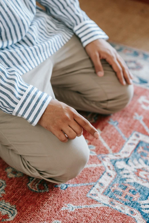 a close up of a person sitting on a rug, hurufiyya, praying posture, max dennison, modest, beige