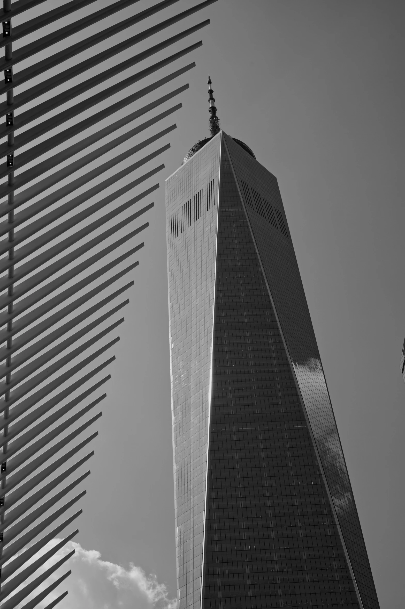 a black and white photo of a tall building, unsplash contest winner, 9 / 1 1 attacks, spikes, mane, shadowy